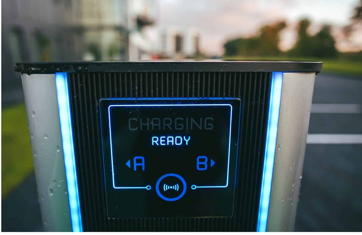 Electric vehicle charging station displaying "charging ready" status at a commercial EV charging station.