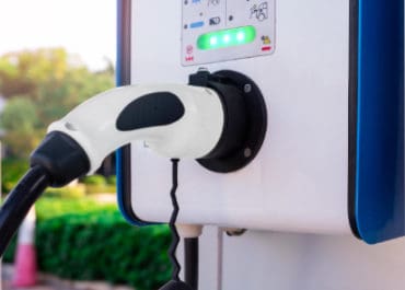 Electric vehicle charging station with plug-in Level 2 and DC fast ev charger.