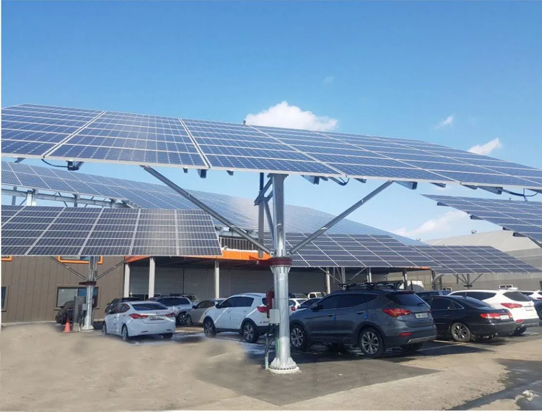 Solar panel canopy over a parking lot providing shade to parked cars and equipped with Arizona commercial EV charging stations.