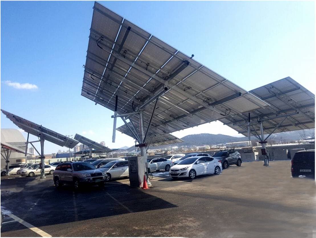 Parking lot equipped with solar panel canopies and Arizona commercial EV charging stations.