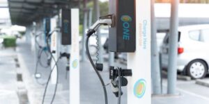 Electric vehicle charging stations with a car plugged in.