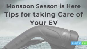 Electric vehicle charging cable against a stormy sky with text: 'monsoon season is here - EV care and maintenance tips for taking care of your EV - energyone'.