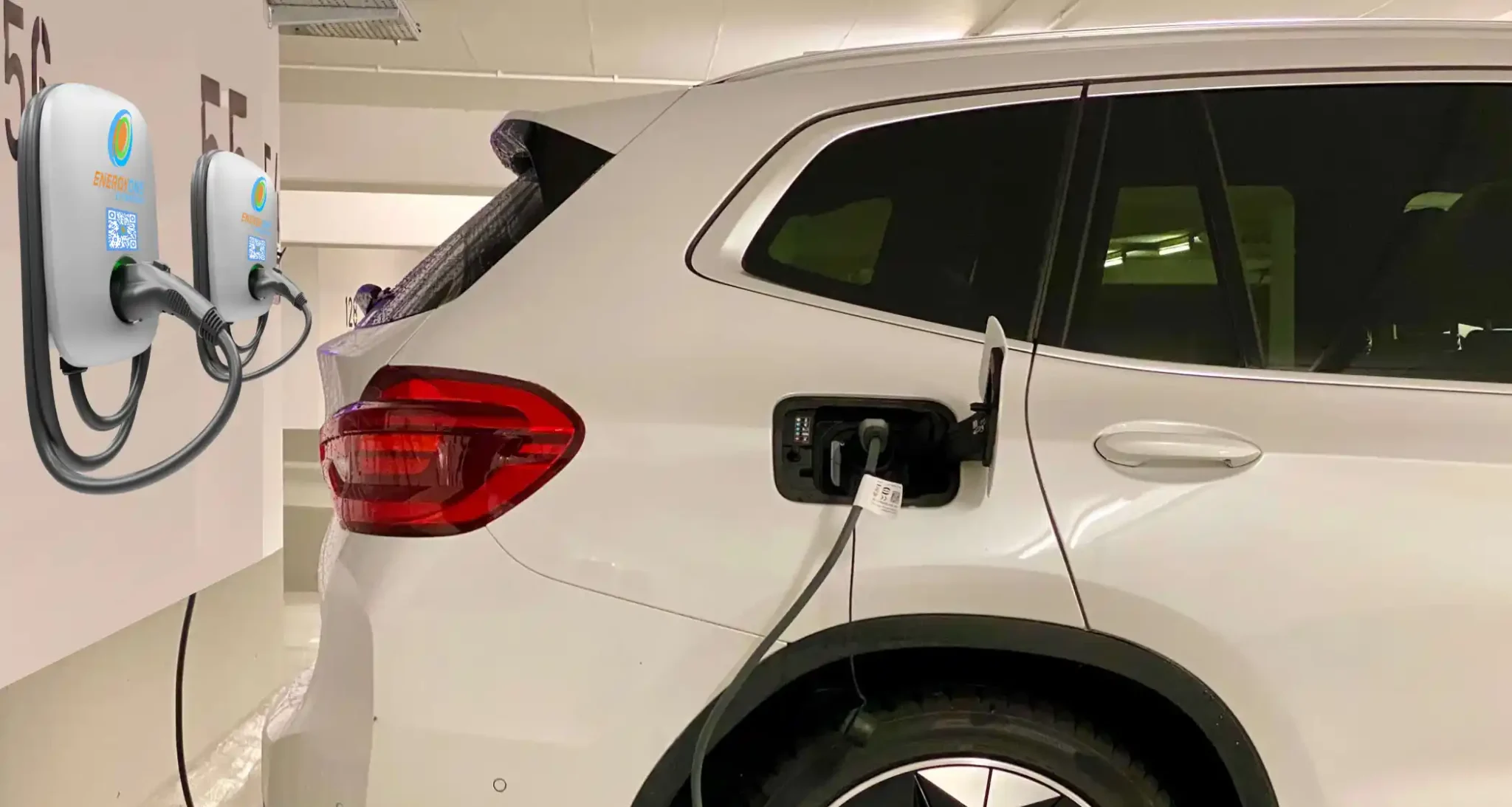 EnergyOne EV Charger plugged in and charging at a charging station.