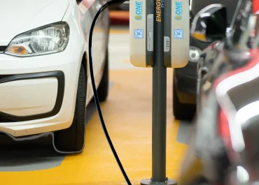 EnergyOne Level 2 electric vehicle charging at a parking lot station.