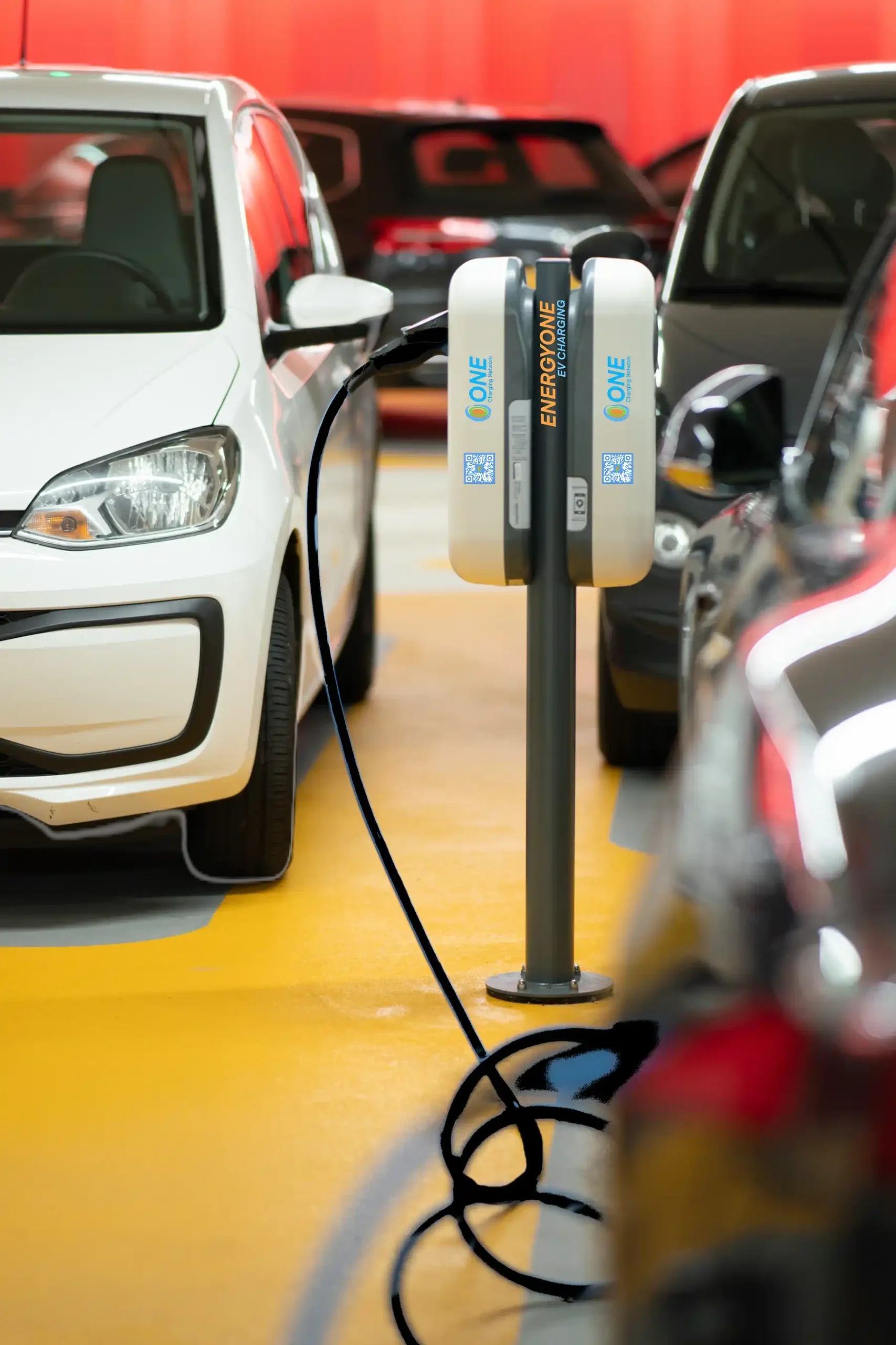 EnergyOne Level 2 electric vehicle charging at a parking lot station.