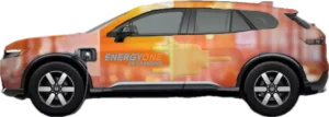 Orange electric vehicle with "ENERGY ONE EV CHARGING" branding, featuring a large plug graphic across the side.